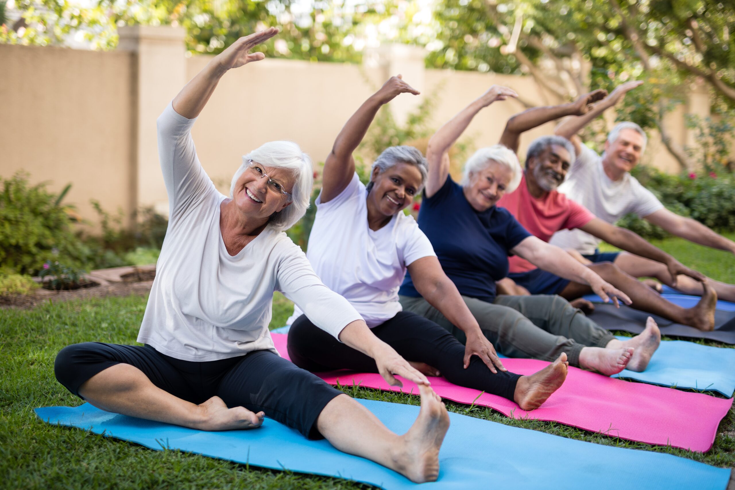 seniors doing yoga in yard
