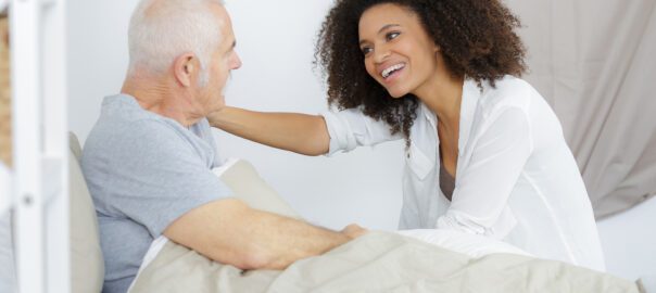 doctor greeting an elderly patient under her care